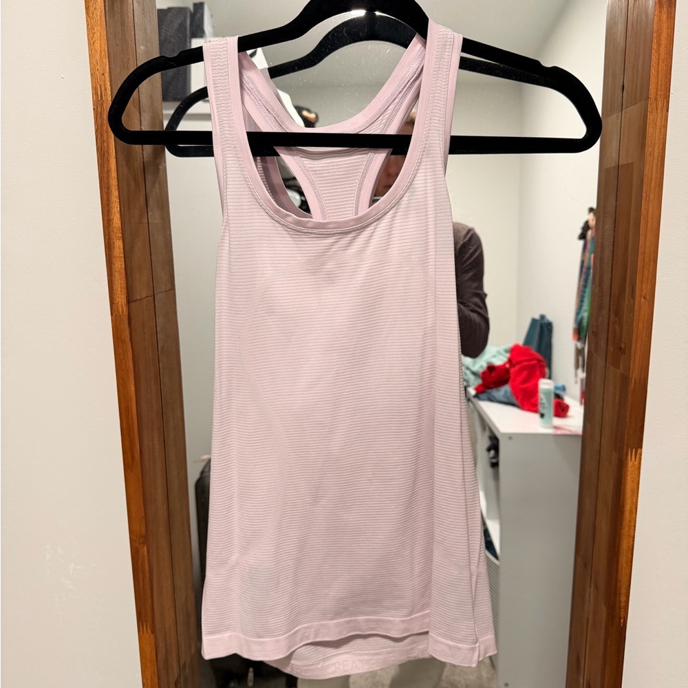 Swiftly tank hip length